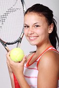 Woman with tennis racket and ball