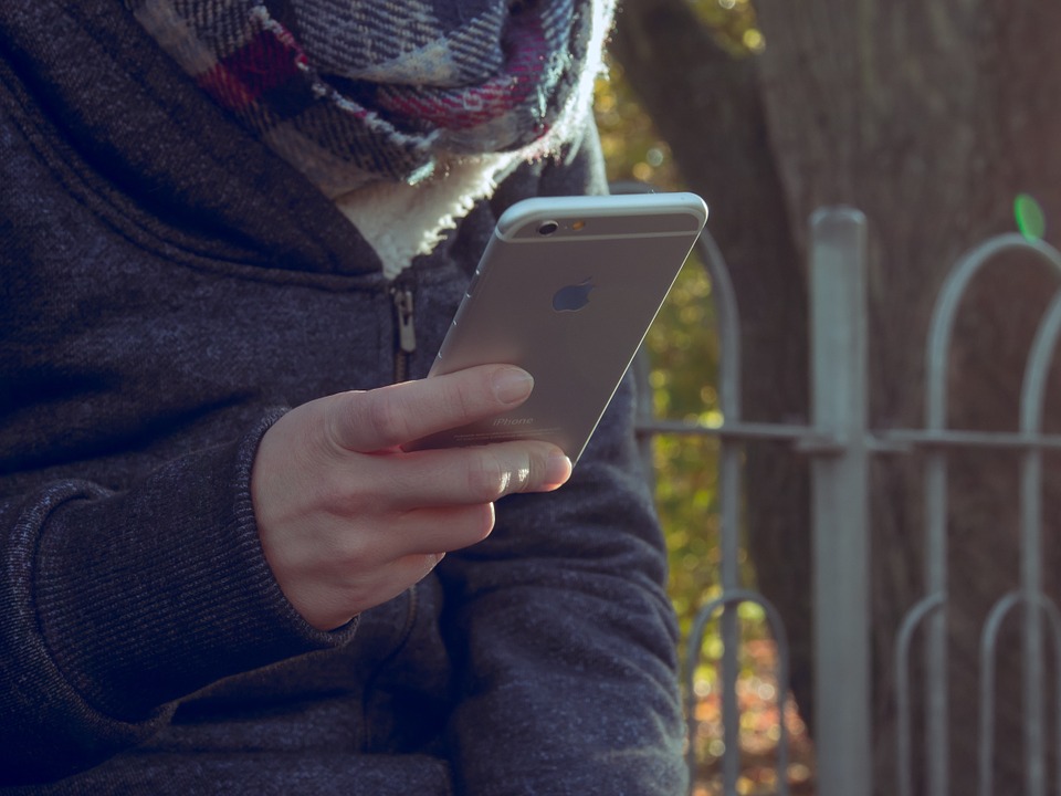 holding smartphone